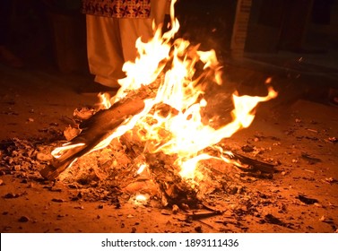 Lighting of bonfire during Punjabi festival Lohri in India. Lohri festival marks the end of winter season and the onset of longer days