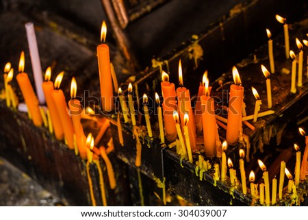 lighting candles in a church