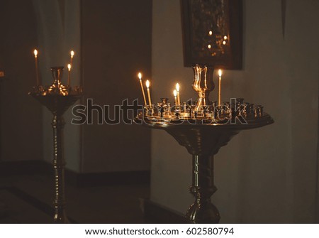 lighting candles in a church