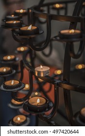 Lighting candles dedicated to loved ones in Reykjavik Cathedral, Iceland