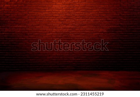 lighting effect red or brown on empty brick wall background for design. dark black brick wall background, rough concrete, plastered concrete floor, with bright red glowing lights from above. 