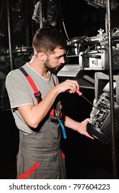 The lighting engineer adjusts the lights on the stage.