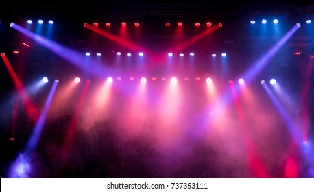 Lighting equipment on an empty stage. Red and blue.