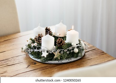 Lighting the first candle on the Advent Wreath on the first Sunday in December to celebrate the beginiing of Christmas holidays in Switzerland.