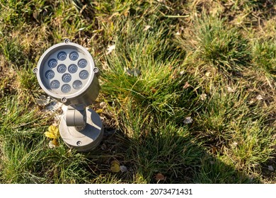 Lighting Fixture For Illuminating Landscape Design Elements Is Built Into The Lawn.