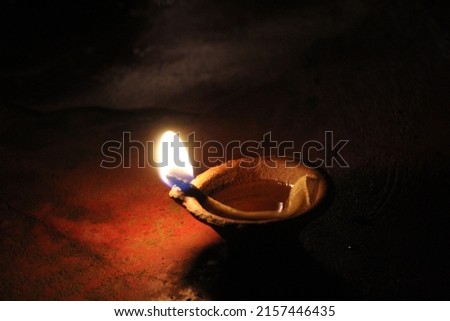 Lighting lamps to celebrate Deepavali