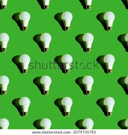Lighting lamps seamless pattern. Background on the theme of light bulbs