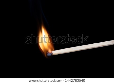 Lighting matches at the moment when it explodes. Burning match over black background. Close up. Copy space.