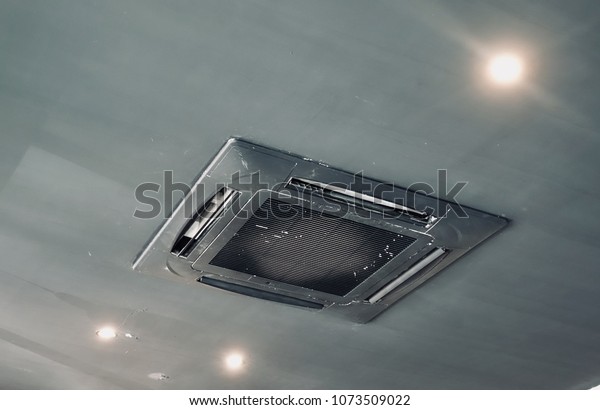 Lighting Old Ceiling Mounted Air Conditioner Stock Photo