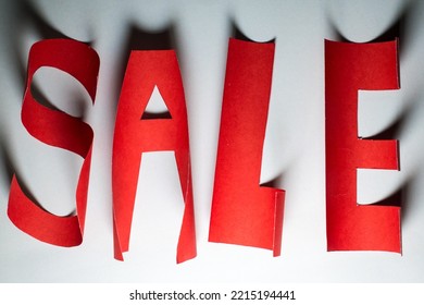 Lighting A Red Sale Banner On Blue Blackboard