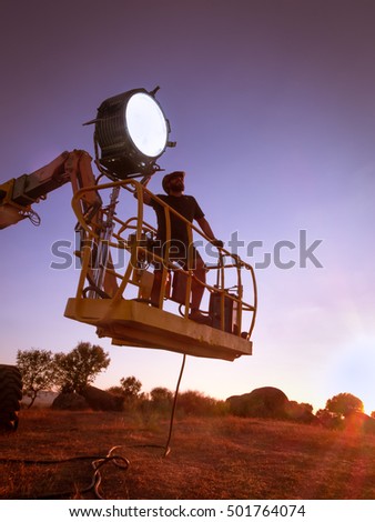 lighting technician, placing the light during a film