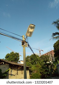 lighting in a village with blue sky