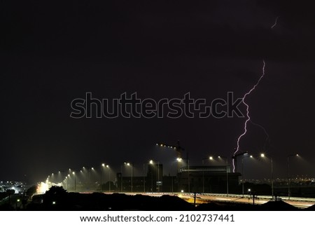 The lightning was falling and it was raining in the evening.