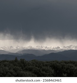 lightning flash over the snow capped mountains