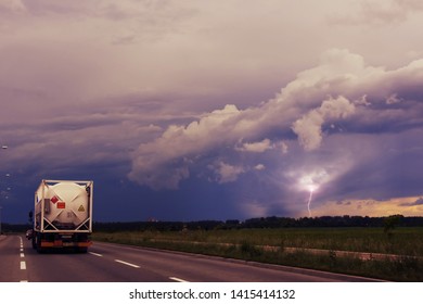 Lightning Hits The Field As The Truck Carrying Portable Fuel Tank Races Against The Storm
