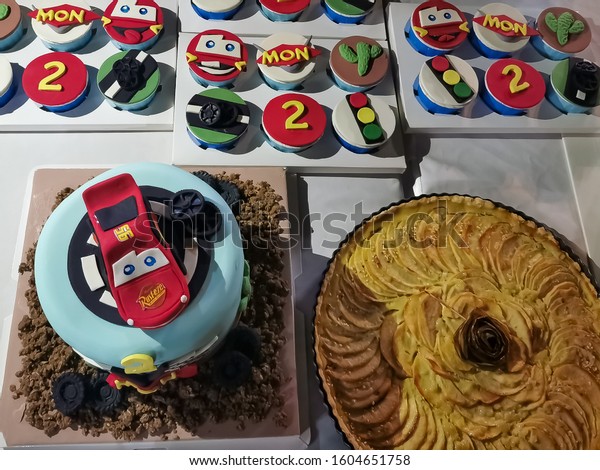 Lightning McQueen Car Model Cake for little 2\
years old boy, Disney Pixar Movie Cartoon Characters, Children\
birthday party, Vientiane, Laos, 1st January 2020. Close up and\
background image.