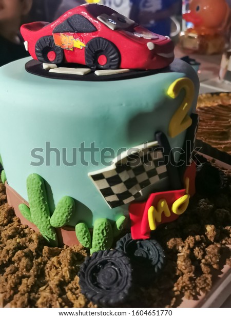 Lightning McQueen Car Model Cake for little 2
years old boy, Disney Pixar Movie Cartoon Characters, Children
birthday party, Vientiane, Laos, 1st January 2020. Close up and
background image.