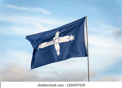 Lightning Ridge, Australia - April 10 2014: Eureka Stockade Flag Full Mast Blowing In The Wind