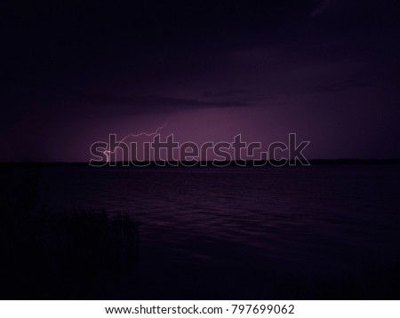 lightning in the sky above the water