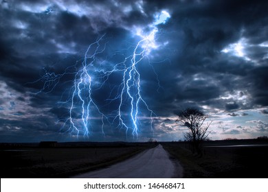 Lightning Storm Over Asphalt Road