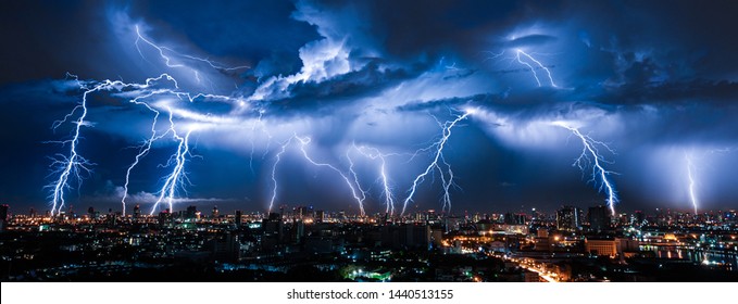 Lightning storm over city in purple light - Shutterstock ID 1440513155