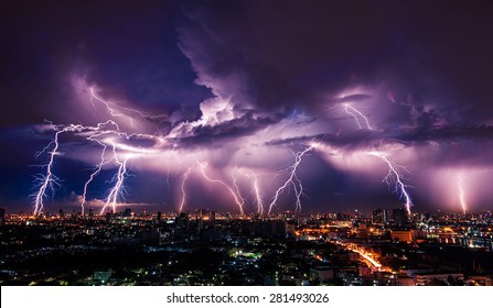 Lightning storm over city in purple light - Shutterstock ID 281493026