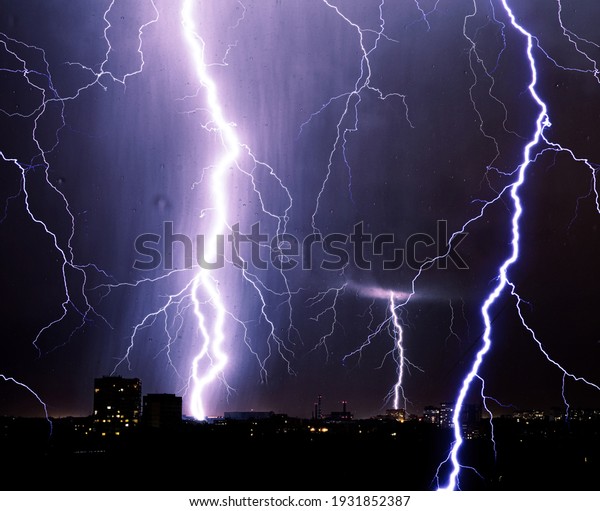 Lightning storm over city,\
thunderbolt