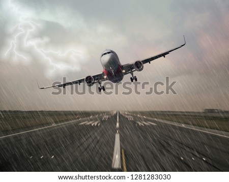 Lightning strike on an airplane in bad weather raining thunderstorm during  landing at the airport runway. Pilots unable to make a successful landing and making a go around. Dangerous hazard concept.