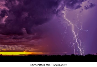 Lightning strike in a stormy sky. Lightning strike in the night sky. Night clouds with lightning strikes. Thunderbolt in sky - Shutterstock ID 2201872219