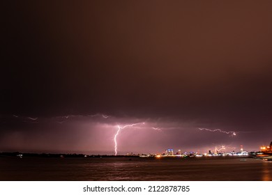 Lightning Striking The City Of Rosario. Photo Taken From The Paraná River.