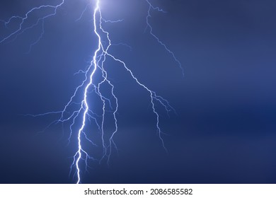 Lightning Or Thunderbolt In Night Storm In Dramatic Blue Light