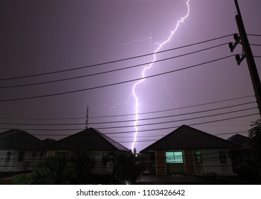 lightning  to village with dramatic clouds during raining