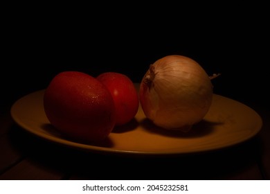 Lightpainting Photograph Of Vegetables On A Yellow Plate. Renaissance Painting Effect.