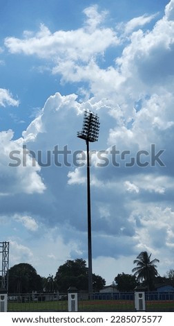 lightpole with blue clouds background 
