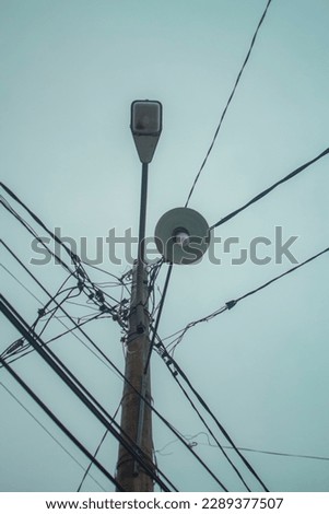 Lightpole and complex cabel route - stock photo