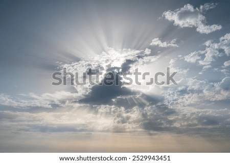 lightrays in the sky with big clouds