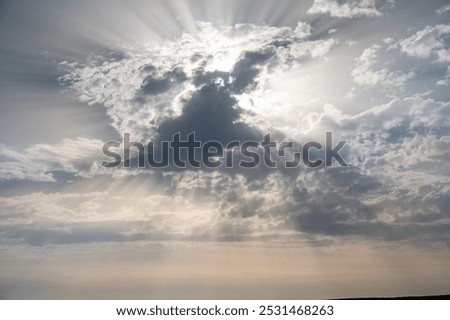 lightrays in the sky with big clouds