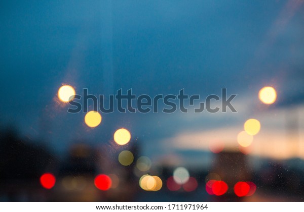 Lights bokeh on night road. Night sky in city.
Blurred lights on road