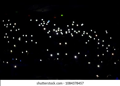 Lights and camera flash at concert, show, hall. - Shutterstock ID 1084378457
