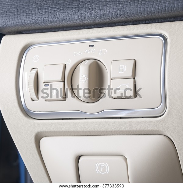 Lights control\
switch in white car\
interior