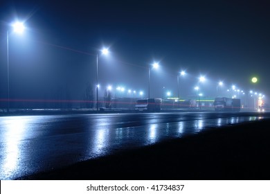 Lights And Light Traces On Road At Night And In The Fog