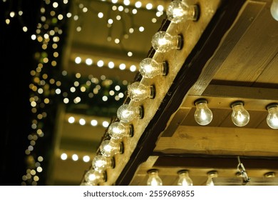 The lights are lit up and shining brightly. The lights are on a wooden structure. The lights are on a Christmas tree - Powered by Shutterstock