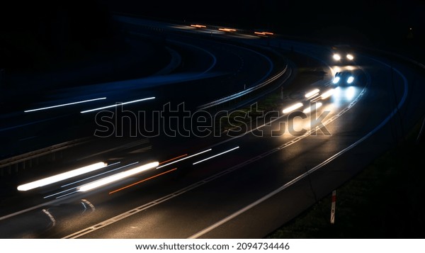 lights of moving\
cars at night. long\
exposure