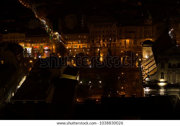 Lights of the old city from the height of the\
flight - at night