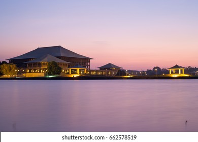 Lights On Parliament Of Sri Lanka Building Across Diyawanna Lake Water, In Evening Sky Background