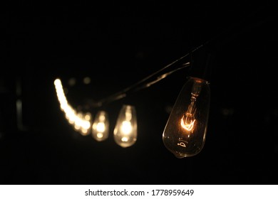Lights on a string in the night.
