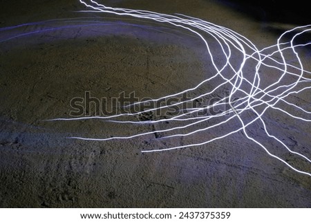 Lights Photography. Long Exposure. Light trail in circular shape. Lights from the movement of the RC (Remote Control) Car. Blur Motion. Long Exposure Shot