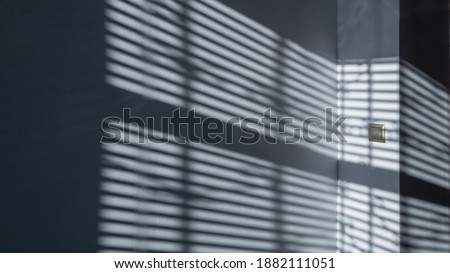 Lights shadows. Abstract light, black shadow overlay from window on white texture wall. Sunlight architecture background. Textures Light reflection from the window.