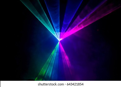 Lights show. Lazer show. Night club dj party people enjoy of music dancing sound with colorful light. club night light dj party club. With Smoke Machine and lights. 