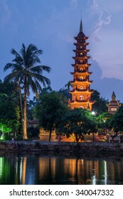 Lights Of Tran Quoc Pagoda Reflected In Lake By Night, Hanoi